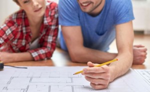 couple looking at remodeling plans