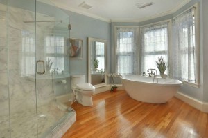 beautiful bathroom with hardwood floors and clawfoot tub