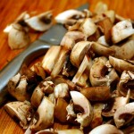 chopped mushrooms on cutting board - best housewarming gifts