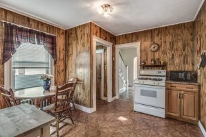kitchen with faux wood paneling