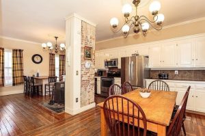 house for sale in lowell - exposed brick in kitchen