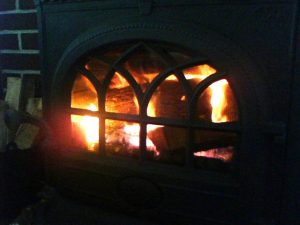 fire in wood stove - wood stove vs fireplace