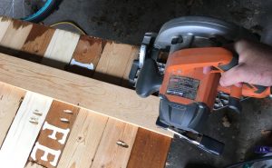 clamp scrap wood to cut a straight line with circular saw