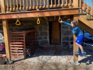 using wood block to reach monkey bars