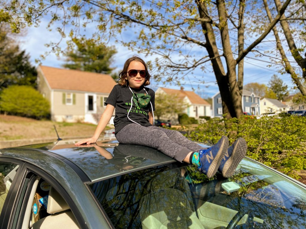 kid on top of the car