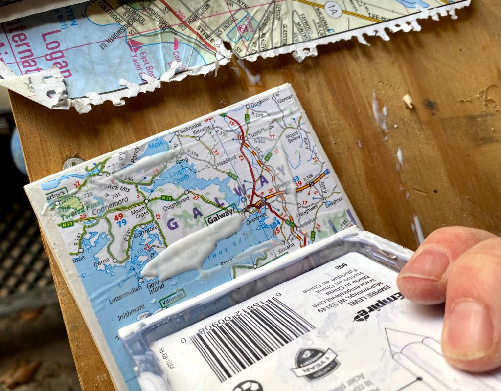 squeeze out excess mod podge on your map coasters