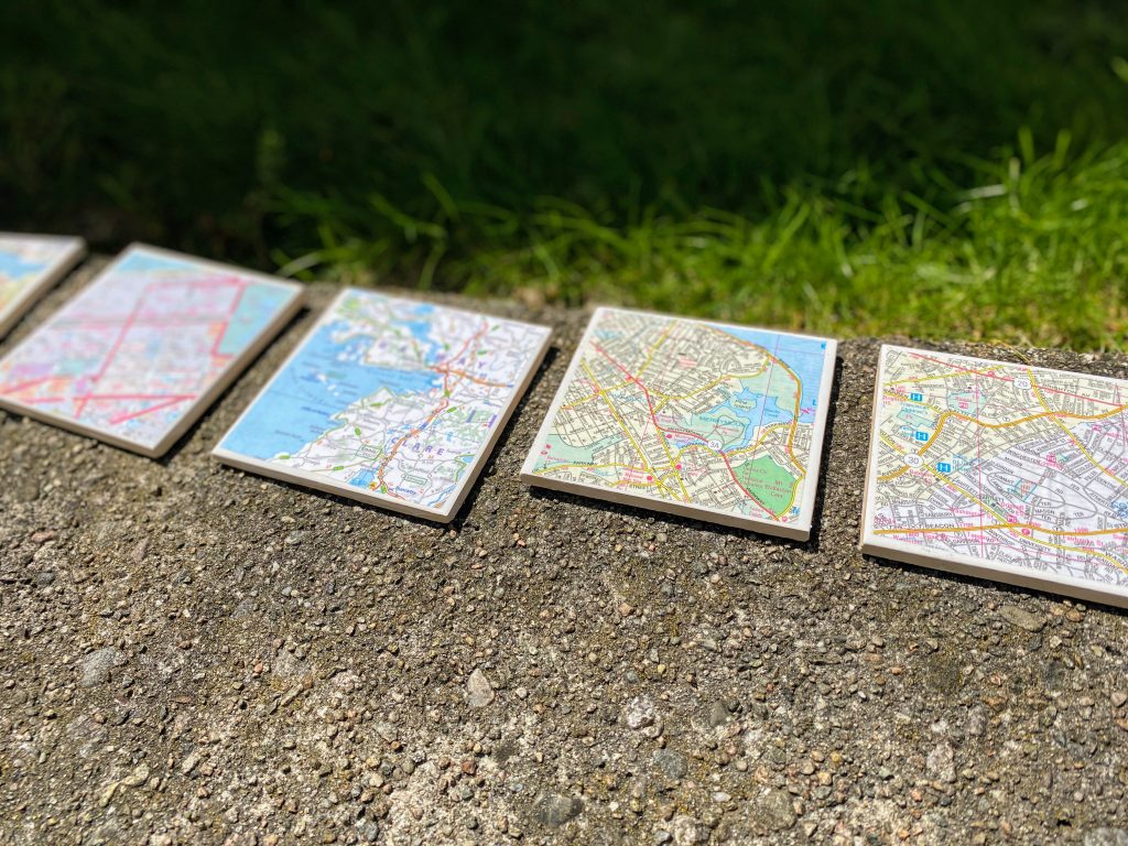 homemade map coasters sitting in the sun to dry