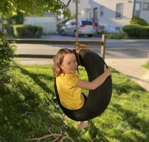 how to make a tire swing - genny tries out the tire swing and approves