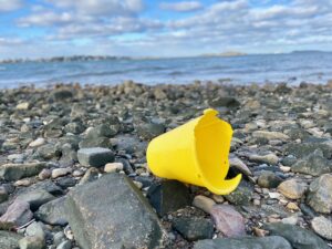 broken plastic bucket on wollaston beach - how to reduce plastic waste at home