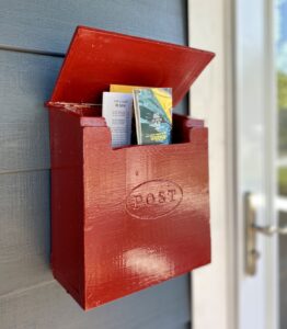 DIY red wood mailbox with mail inside