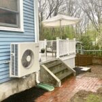 heat pumps cut tons of carbon - heat pump on the side of a Victorian house