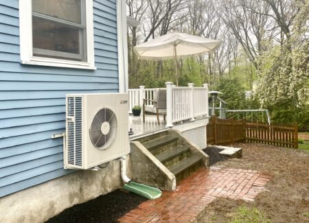 heat pumps cut tons of carbon - heat pump on the side of a Victorian house