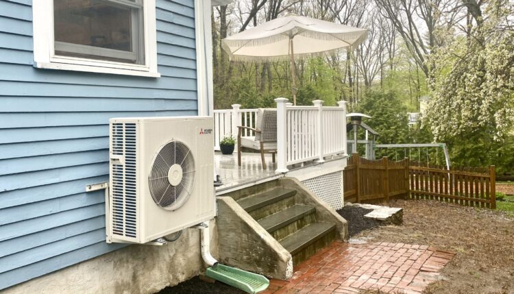 heat pumps cut tons of carbon - heat pump on the side of a Victorian house