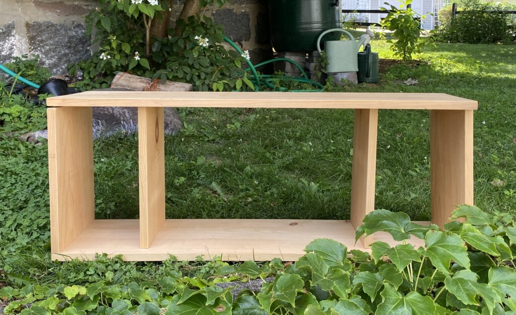 diy record player stand under construction, loose fit with dividers on either side and a large space in the middle